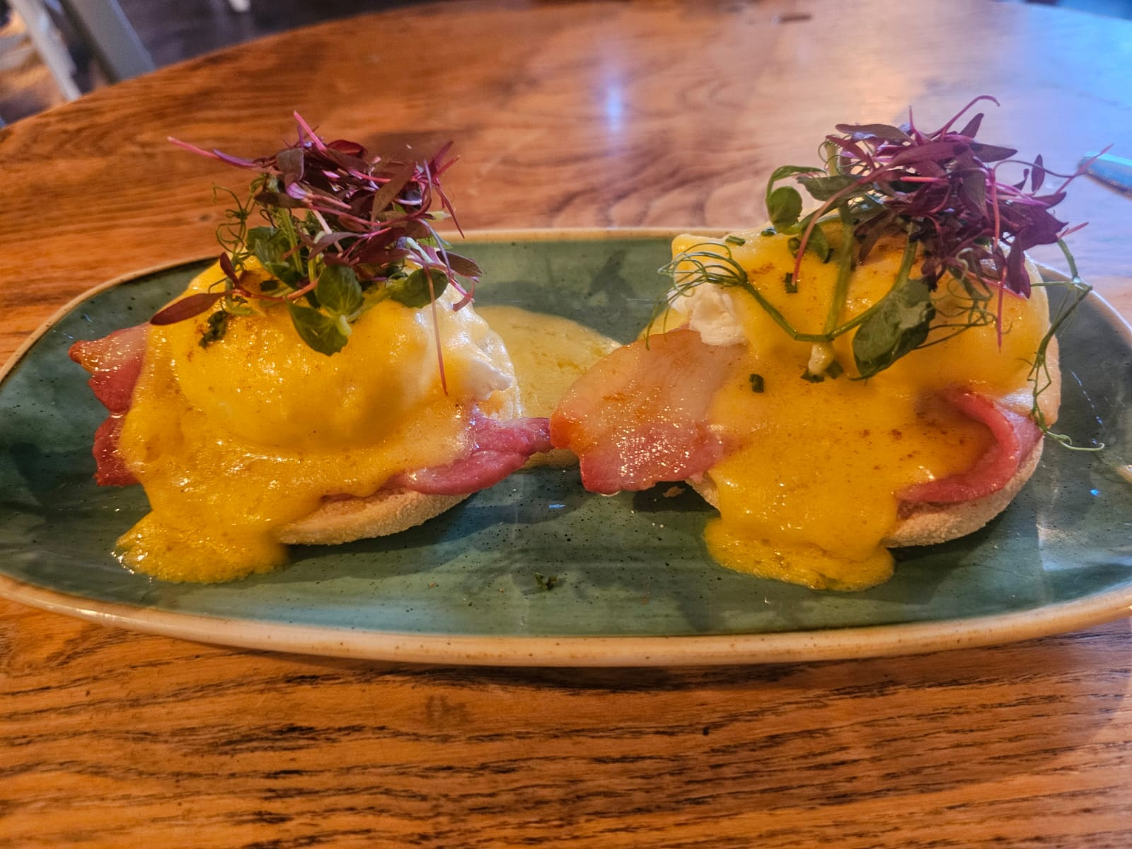 Eggs Benedict with thick bacon and Hollandaise on a toasted muffin, made in our kitchen