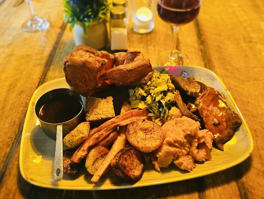 Roast dinner with beef, Yorkshire pudding, roast potatoes and vegetables at The Ilchester Arms